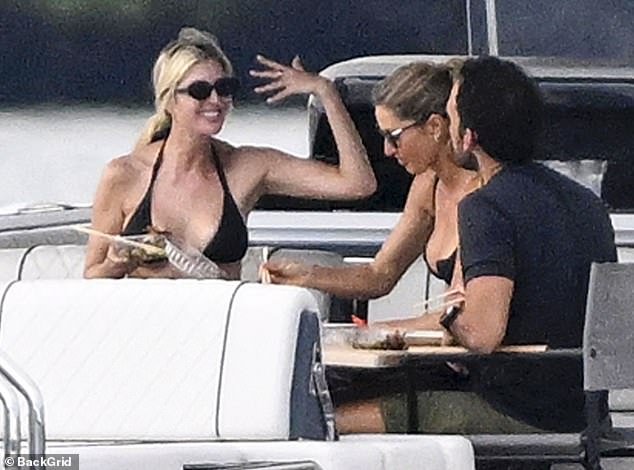 101949751-15077967-Ivanka_Trump_enjoyed_her_Sunday_on_a_boat_in_Miami_with_celeb_pa-m-6_1757352259464.jpg