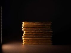 Ouro brilha, mas blue chips lutam em negociações calmas