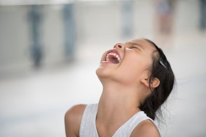 adorable-little-girl-laughing-street.jpg